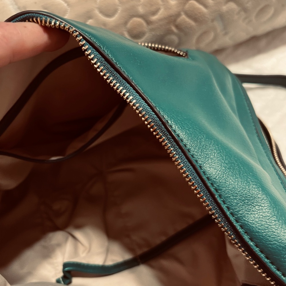 Leather bag. Pouch style. Bottom zipper allows bag to widen. Great for travel